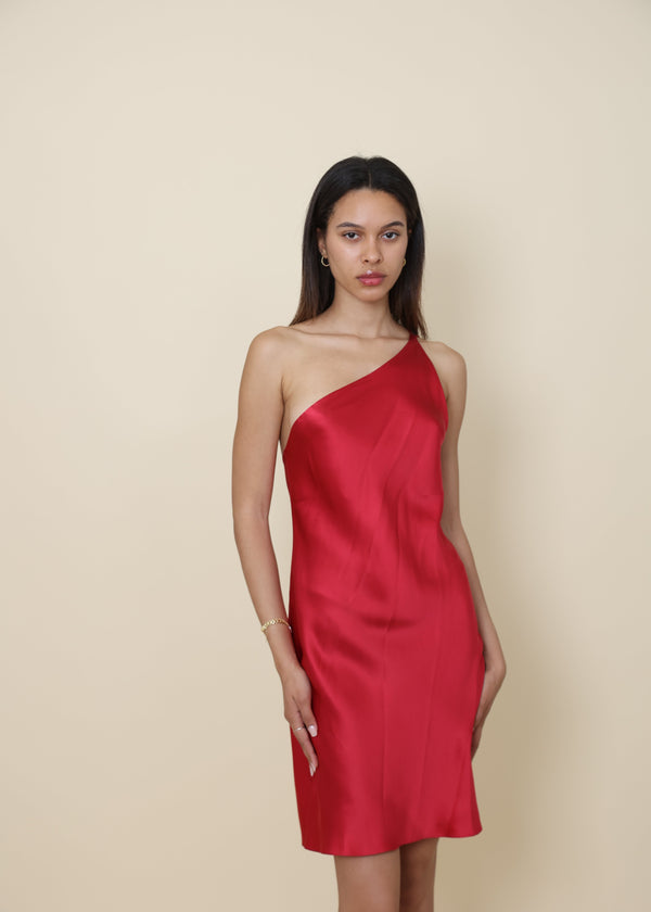 Red one-shoulder silk slip dress